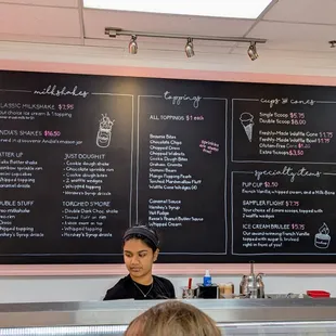 Wall menu. 1 of 2. Milkshakes, toppings, cups and cones, specialty items.