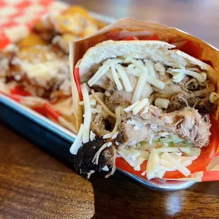 Pernil Arepa: Slow-roasted pork, tomato, cheese, avo, garlic sauce ($13)+Plátanos con Queso: Sweet plantains, sour cream, queso fresco ($7)