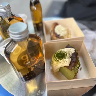 Tea, osmanthus oolong basque lava cake (back), Basque Matcha Lava Cheesecake (front)