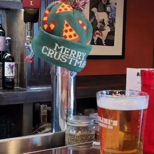 a pint of beer and a christmas hat