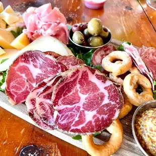 a platter of meat and cheese