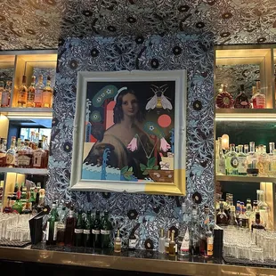 a picture of a woman behind a bar