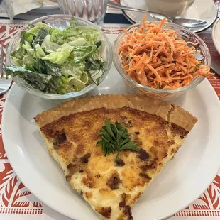 quiche lorraine with green salad and carrot salad