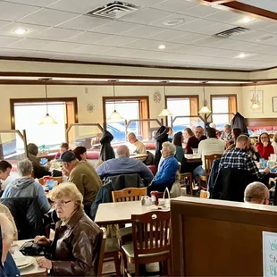 a large group of people sitting at tables