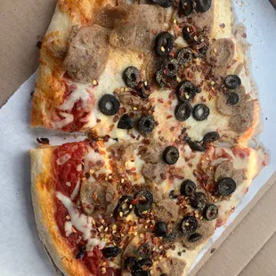 a slice of pizza in a box