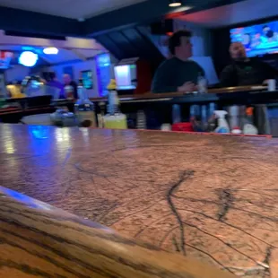 a bar with people in the background