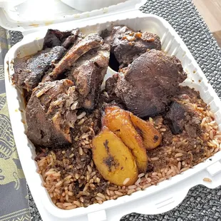 Jerk Chicken and Stewed Chicken with plantains and rice and beans