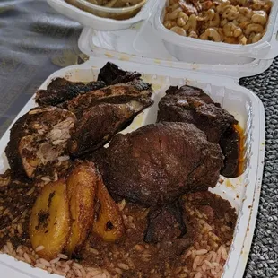 Jerk Chicken, Stewed Chicken, Cabbage, Macaroni &amp; Cheese, Fried Plantains, Rice And Peas