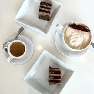 Mocha and espresso accompanied by raspberry chocolate cake