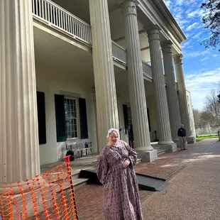 The front of the main house &amp; one of the very knowledgeable tour guides