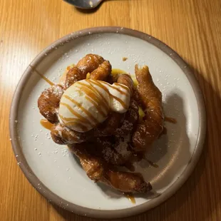 Funnel cake with sweet cream gelato and peach puree