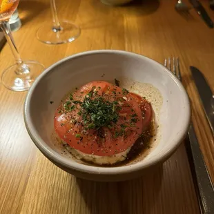 Tomato steak with halibut, beef brodo, brown butter, garlic corn mayo, and coriander