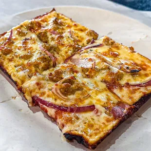 a slice of pizza on a plate