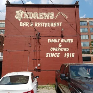 two cars parked in front of a building