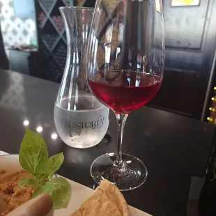Glass of Rachella, Rose of Cabernet Sauvignon and Muhammara (Roasted Red Peppers, pomegranate, walnut, lemon choice)