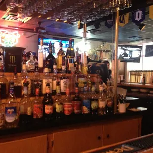 a bar full of beer bottles