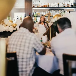 a group of people sitting at a table