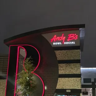 the neon sign for andy b's bowl social