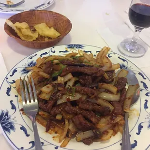 The delicious Mongolian beef I had at Andy's Nice House. Loved the dish and the price. Also had their house red wine. Great meal!