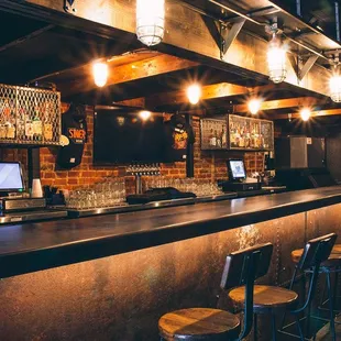 a long bar with stools