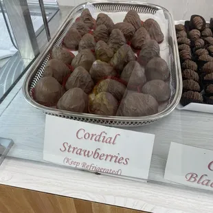 a display of candies and strawberries