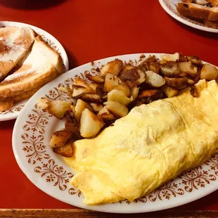 Sausage and cheddar omelette with home fries and toast. $8.95. It was good. Cooked well, but nothing special.