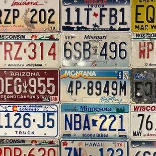a wall of license plates