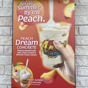 a hand holding a drink