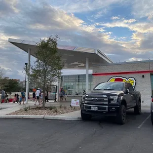 two trucks parked in front of a building