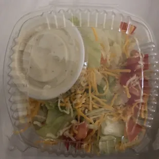 a salad in a plastic container