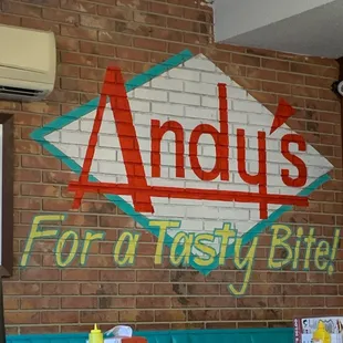 a sign for a tasty biter