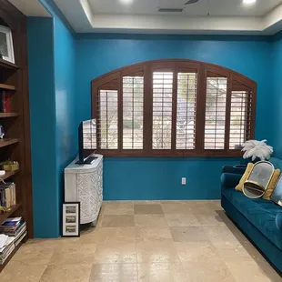 Wooden shudders and bookcase