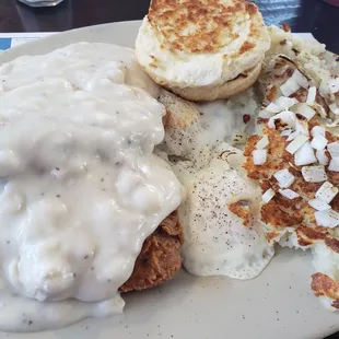 Chicken fried steak, eggs over easy w/biscuit and side of home fries.