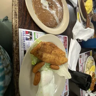 Catfish, hush puppies, eggs and pancakes
