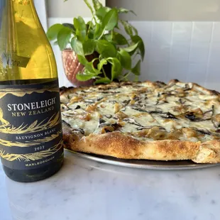 a bottle of wine and a pizza