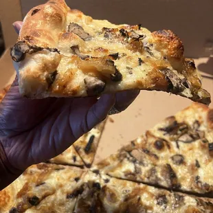 Look at how thin that "pizza bed" is and that outer crust! Dip worthy.