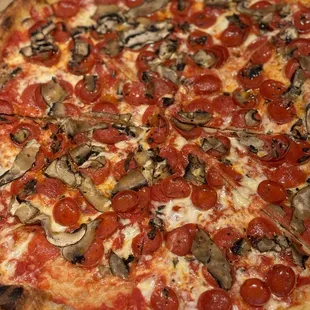 Pepperoni Pie with mushrooms before its end