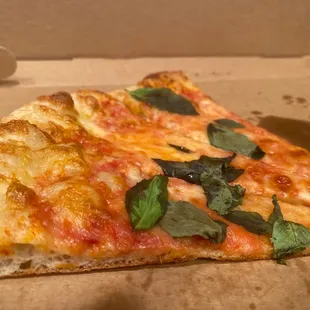 Cheese pizza with fresh basil