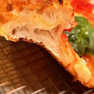 a closeup of a piece of pizza