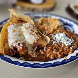 Pork Tamales plate, rice and beans included. The tamales have a good meat vs masa portportion.