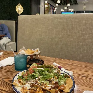 Chicken Nachos, I asked for extra sauce but I regret, just regular as they make us better. The drinks are amazing!!!