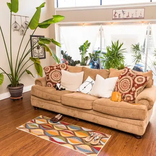 a living room with a couch and a rug