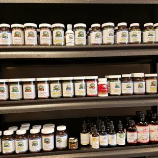 a shelf full of medicine bottles