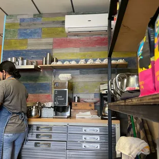 a woman preparing food in a kitchen