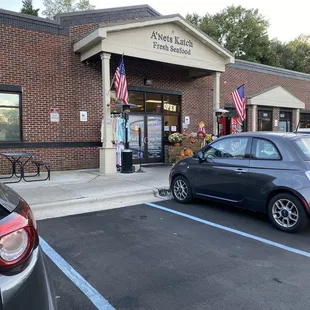 a car parked in front of a store