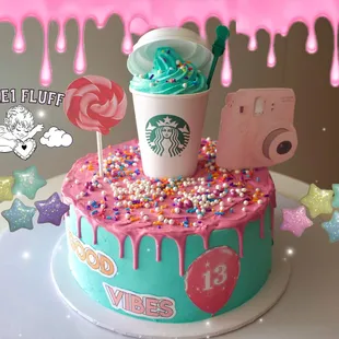 a cake with a starbucks cup on top