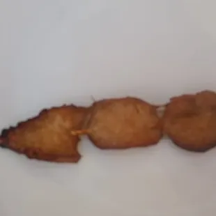 The chicken skewers were paper thin, overcooked, and were like bland jerky.