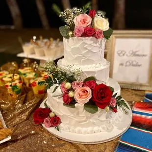 Beautiful sweets/cake table set up, for a fiesta themed wedding.
