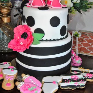 Baby shower cake with matching cake pops and sugar cookies.