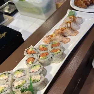 Happy hour rolls and torched scallop, and salmon Nikki sushi